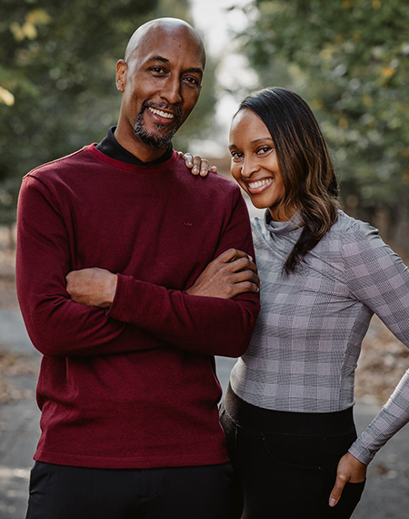 John and April Nixon smiling together outside