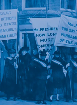 Blue tinted old photograph of people holding picket signs