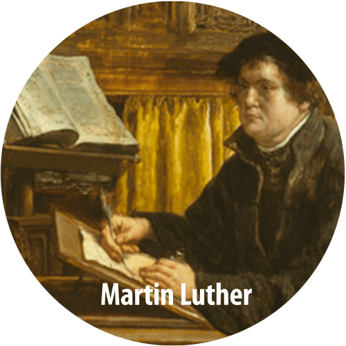 Martin Luther painted sitting at a desk writing with a quill