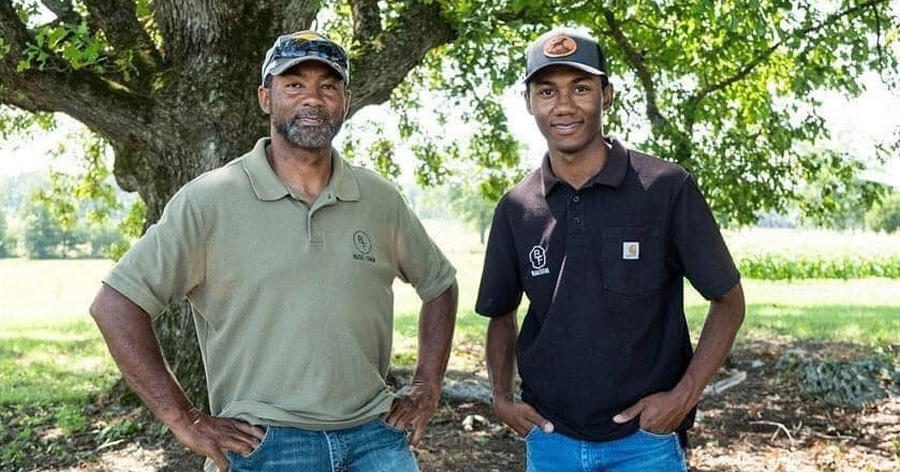 man and his son at their family farm