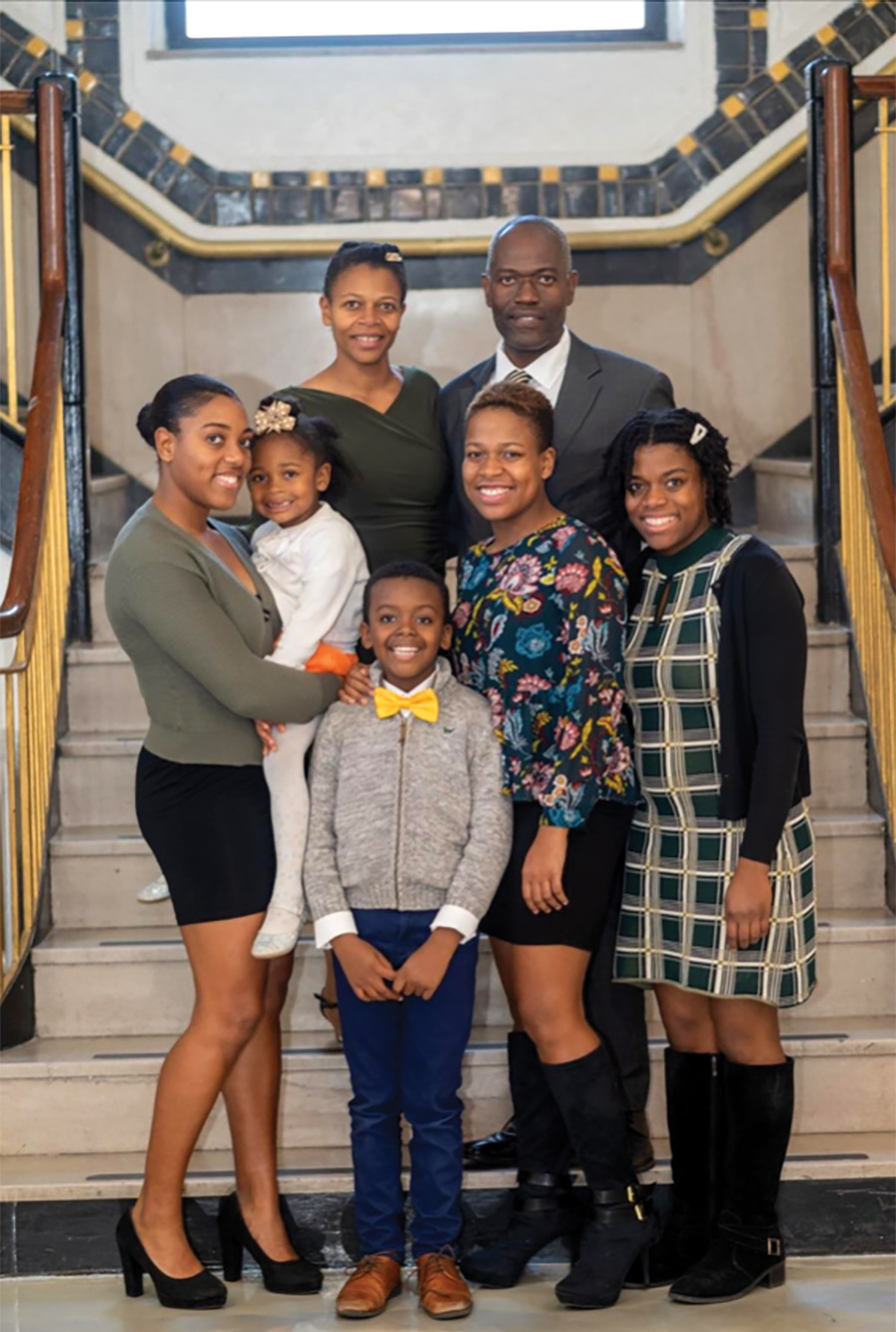Aisha and Maurice Edwards, surrounded by their children