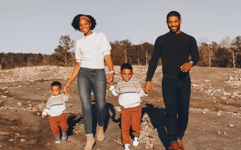 Thea Cole walking with her husband and two of her sons