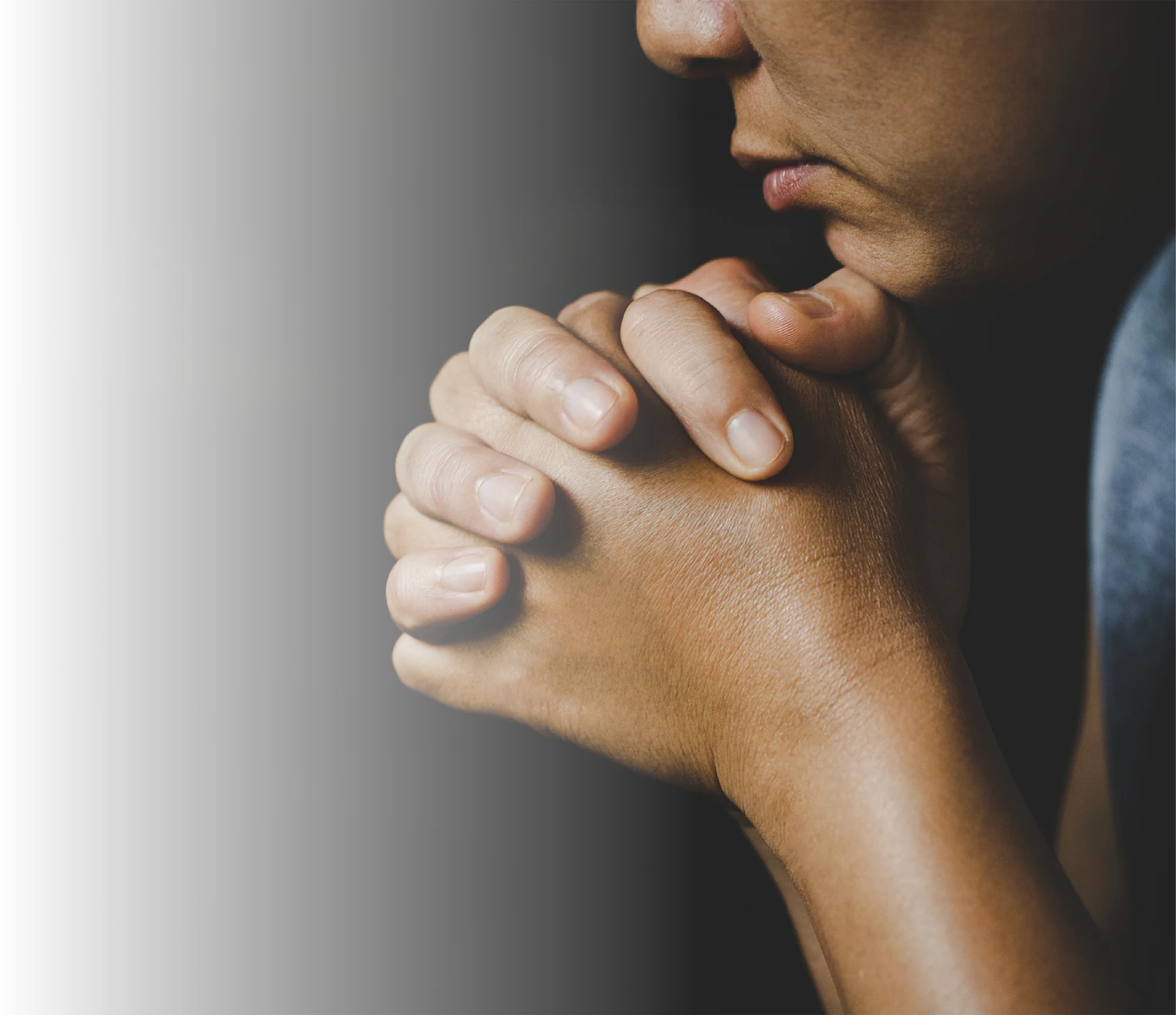 hands intertwined together in prayer