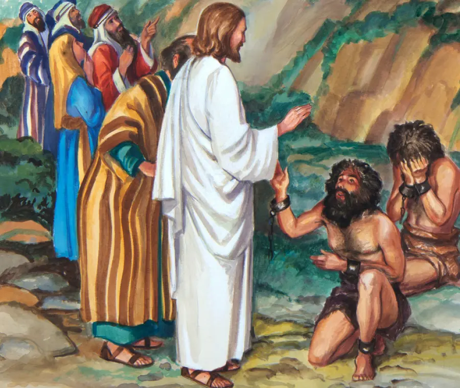 Painting outdoor illustration depiction setting of Jesus situated standing nearby several random people as Jesus himself is seen in a white garment robe outfit with his right hand palm slightly in air at an angle appearing to be praying for/engaging in a significant conversation with two prisoner captive men leaning down on the ground in front of him handcuffed in shackles as they look upon upward at Jesus