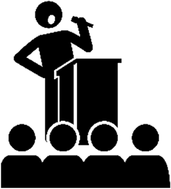 Black icon of a speaker standing behind a podium holding a microphone, facing four silhouettes representing an audience in the foreground.
